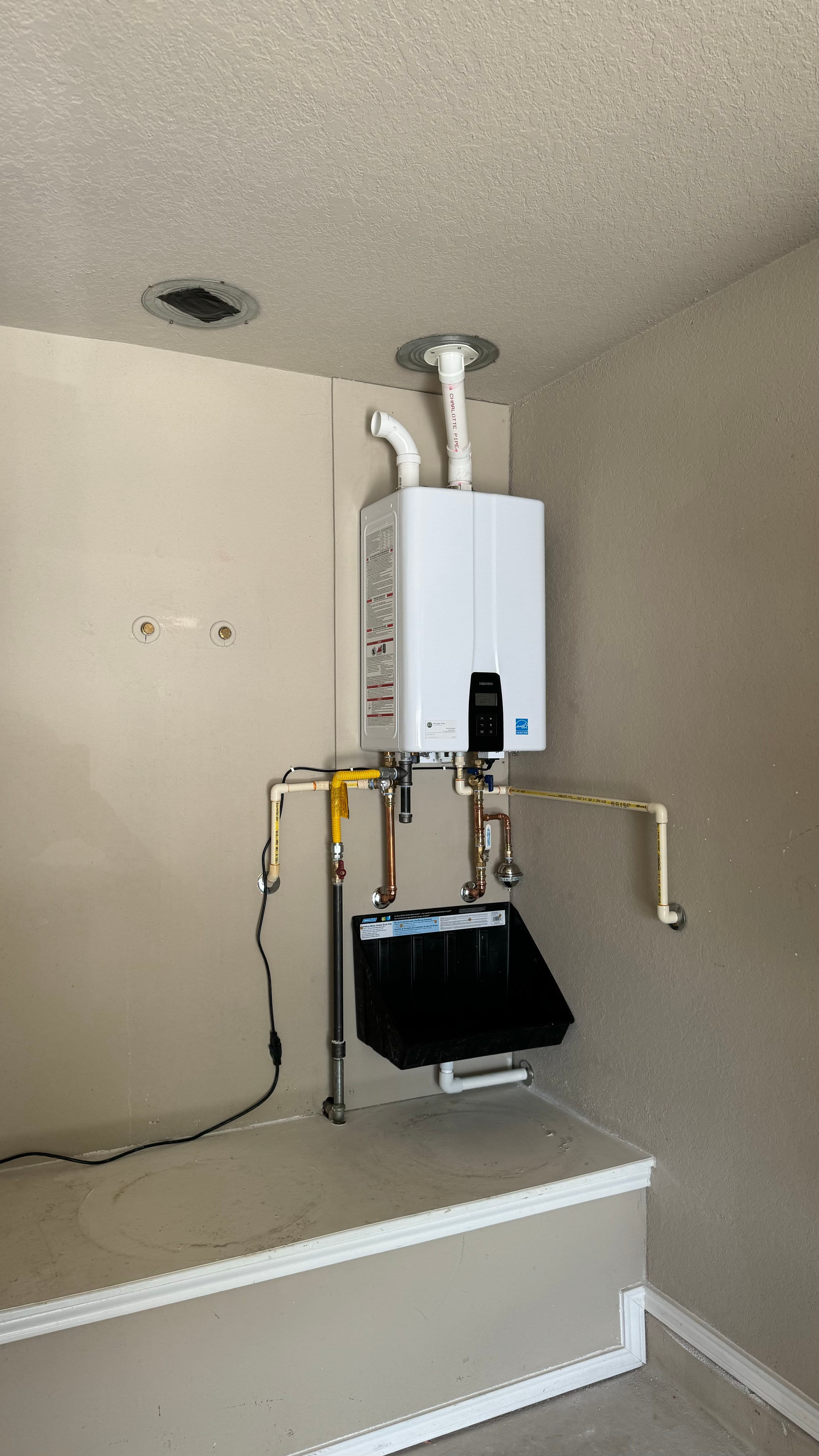 Project Two Old Tank Heaters Out, One Tankless System In image
